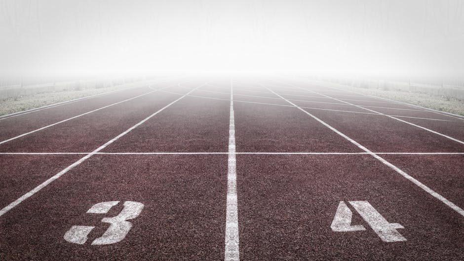 Professional athletic track lanes 3 and 4 highlighting the start of a fitness journey
